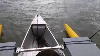 Expandacraft outrigger canoe in rough chop.