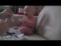 Baby laughing hysterically at ripping paper original