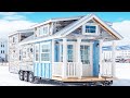 Stunning classy tiny house on wheels set in the snowy forest that everyone admires
