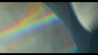 Rotating Prisms Film Grain Bokeh Overlay Effect