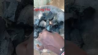 An African girl child lighting fire using charcoal ❤️❤️❤️ #africafoundation