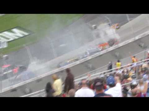 Joey Logano gets turned into the grass and barrel rolls after crossing into Reed Sorenson's path