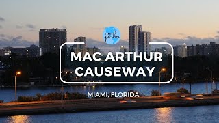 Daylight breaks at MacArthur Causeway, Miami, Florida with a cruise ship pulling into the harbor