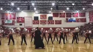Priest shows off dance moves at Catholic high school pep rally