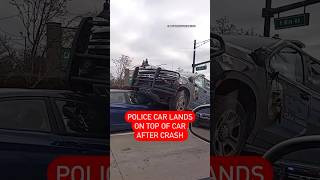 Police car lands ON TOP OF CAR after crash