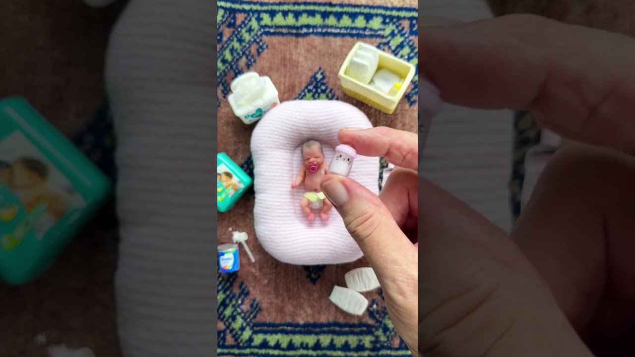 Bottle time for the tiniest silicone baby doll.