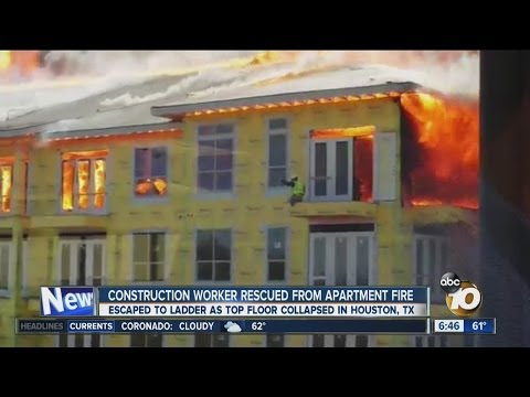 Dramatic rescue at an apartment fire caught on tape as a construction worker barely escapes flames