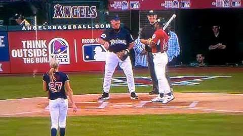 Jenny Finch pitches to Ricky Henderson