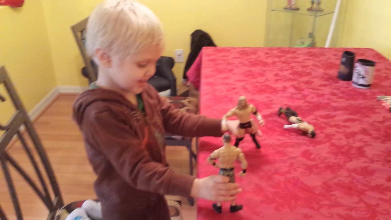 Playing with WWE figures.