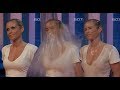 Good looking blonde woman soaked to the skin in nice white dress