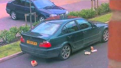 dirty scum bag in a bmw dropping his rubish on the road