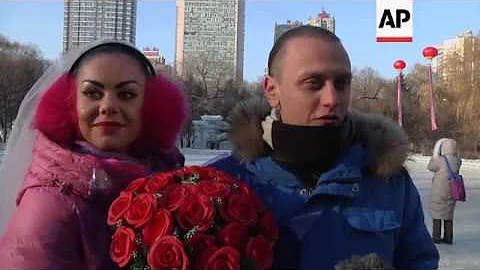 Couples get married at Ice Festival in Harbin, Chi...