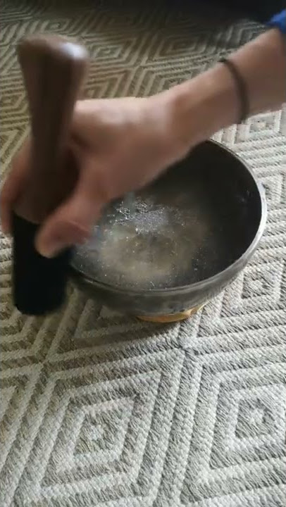 Amazing vibration of singing bowl when played with water inside