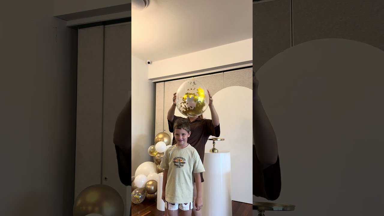 Balloon artist demonstrates how to make confetti stick inside the balloon!