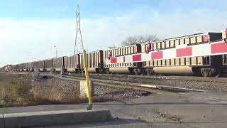 BNSF SD70MAC in BN colors trails on a Mega loaded coal coal