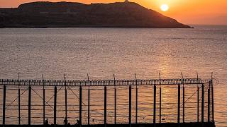 Hundreds of migrants swim from Morocco to the Spanish territory of Ceuta