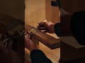Smoothing the wood surface using a metal spokeshave to create a clean and level finish carefully