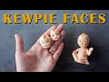 Making clay kewpie doll faces from a vintage figurine