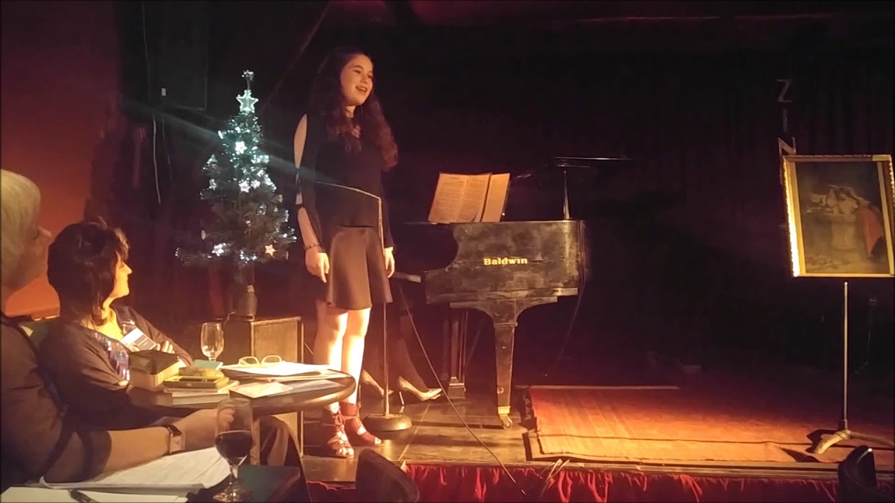Victoria singing at a holiday event at the Zinc Jazz Club, New York