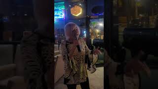 Beach Mama singing "Golden" by Maoli (Glenn Awong) at Tuesday Night Karaoke