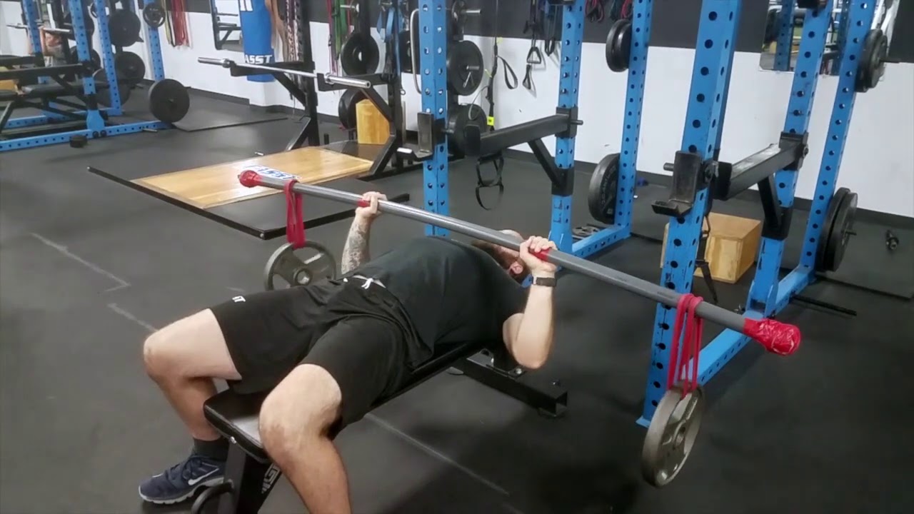 Bamboo bar bench press isometric hold l TNation The Chaos Method l