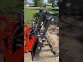 Kubota MX 6000 lifting logs