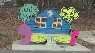 The history of Greensboro neighborhoods displayed on a bench