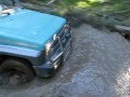 Daihatsu feroza crossing a puddle