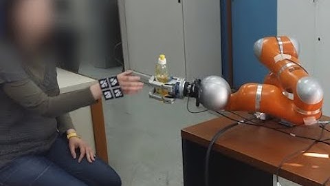 A human inspired handover policy using gaussian mixture models and haptic cues