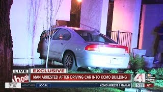 Man arrested after driving car into Kansas City apartment complex