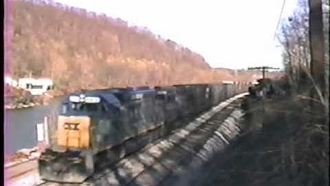 CSX & Seaboard power Q396, while a Chessie helper ties on at S. C-ville. 2/20/1990