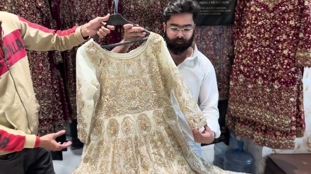 Back front same mexi with heavy load work in umar bridal studio 