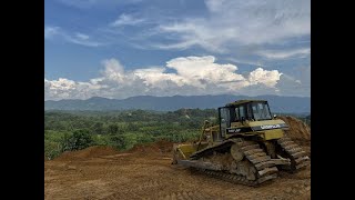 Bulldozer D6H Leveling Ground - On The Edge Of A Hill, Dangerous works