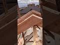 Master Roofer Cuts Timber Rafters Cleanly Using Chainsaw