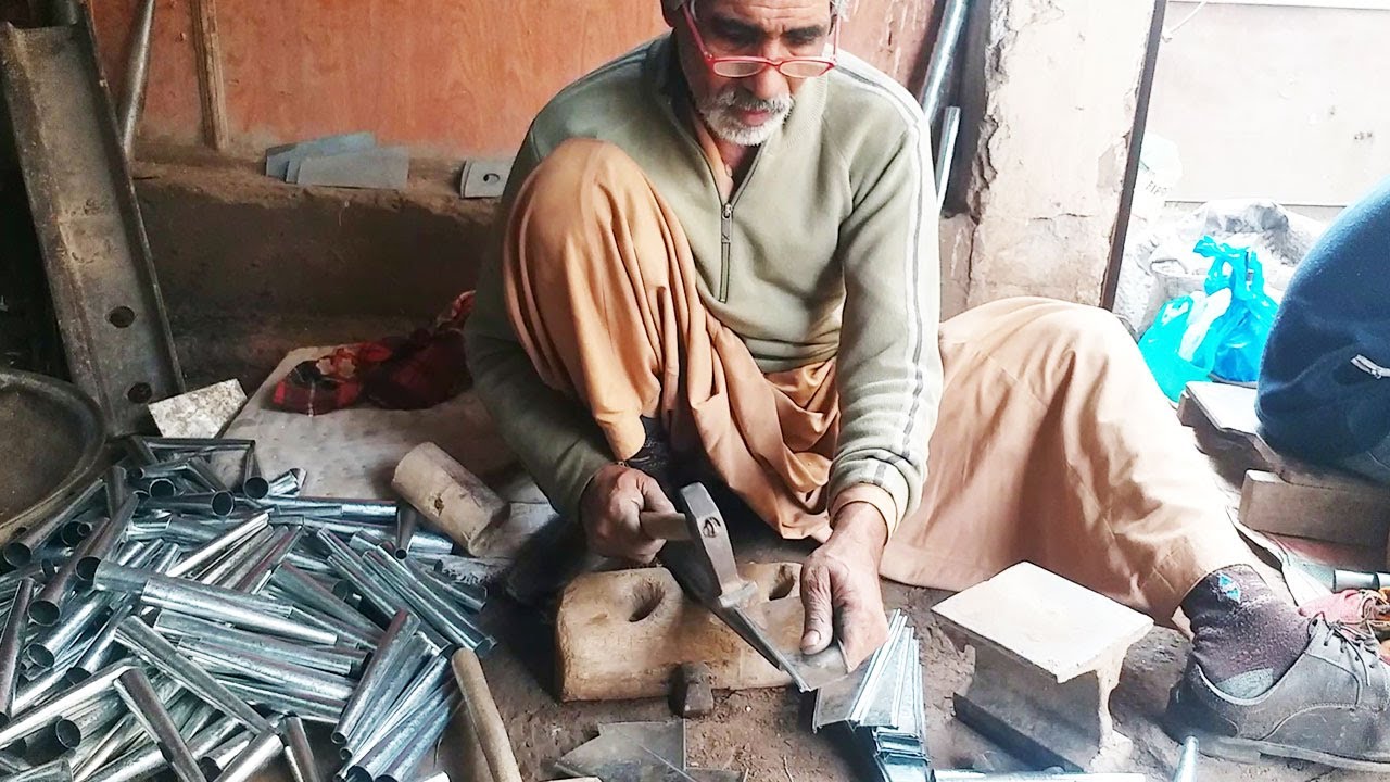 The Old Man Making Metal Kulfi Mold Using Skills