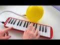 Playing melodica with a balloon