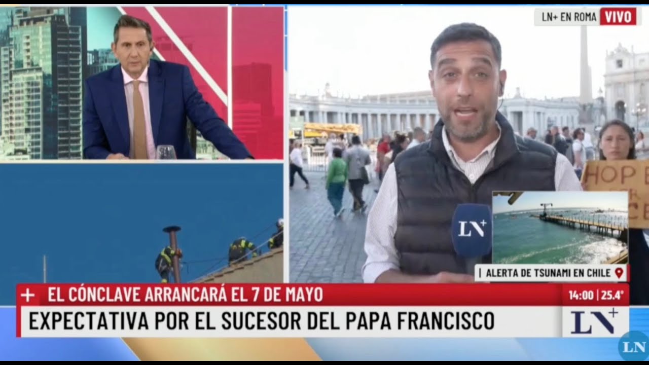 Yona Tukuser holds a "HOPE FOR PEACE" sign in St. Peter's Square at the Vatican during the Conclave