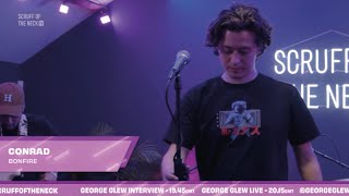Conrad performs at Scruff of the Neck wearing Luminous