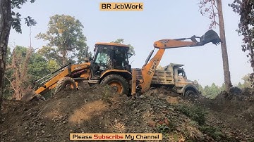 JCB Backhoe Loading The Soil Of The Forest Area on a Tractor For The Construction Of The Pond