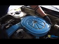Instalación de carburador para ahorrar combustible en un Mazda.