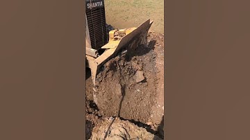 Mini Bulldozers Clearing Base Road For uploading Rock on construction