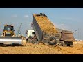 Power Bulldozer Shantui Pushing Operating With Overload Dumper Truck Spreading Dirt