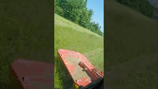 kubota mx6000. ac cab. in 104 deg. heat cutting hay.