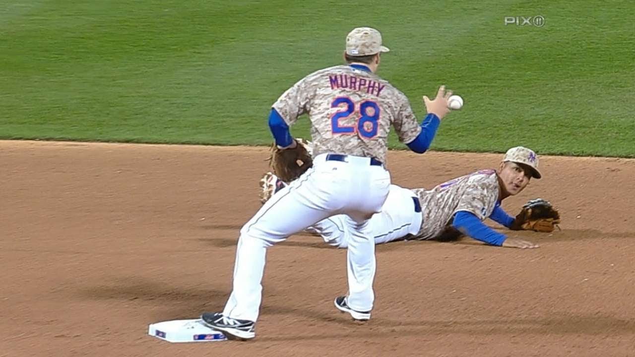 Tejada's diving stop turns great double play