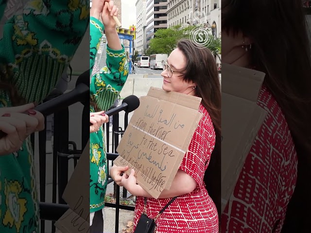 WATCH how this pro-Palestine protestor reacts to us asking her to explain her anti-Semitic sign class=