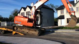 Unloading Hitachi Ex135