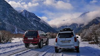 Digging snow off-road in a mountain gorge Mahar