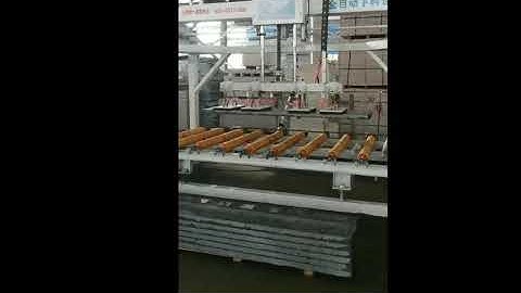 Automatic vacuum slab lifter for loading and unloading