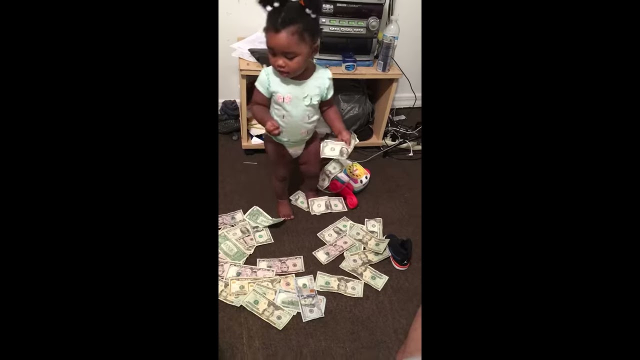 BABY PLAYING IN MONEY - YouTube