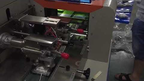 Switch panel flow packing machine with screw falling